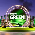 Green Themed Stage With Stay Green Sign And Plant Decorations At Night