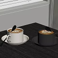 Coffee Drinks in White and Black Cups with Latte Art on Wooden Table and Spoons