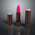 Elegant Cosmetics Display Three Copper Spiral Lipsticks With Open Pink Bullet
