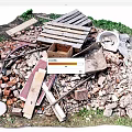 Scattered Stones and Wood Debris With Wooden Planks Bricks and Green Plants