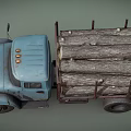 Old Blue Truck Loaded With Stacked Wood Logs For Building Materials