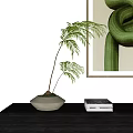 Bonsai Plant With Green Leaves In Light Colored Pot On Black Shelf And Abstract Painting