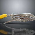 Rusty Pliers With Yellow Handle And Rusty Metal Parts On Black Reflective Surface