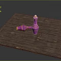 Rustic Wooden Table Displaying Pink Spinning Tops With Gold Accents