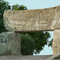 Traditional Stone Entrance Gate With Intricate Carvings Steps Trees And Stone Tablet