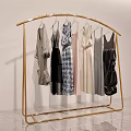 Golden Metal Clothes Rack With Various Stylish Dresses For Modern Retail