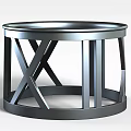 Tech Exhibition Hall Showcasing Modern Metal Circular Table With Crossed Supports And Reflective Surface