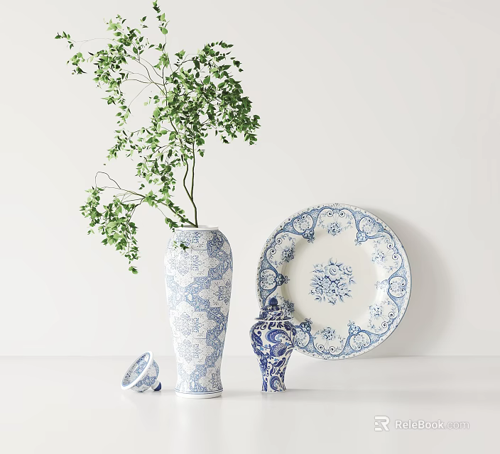 Blue And White Floral Pattern Ceramic Vase Plate Jar With Green Plant On White Tabletop 3d model 
