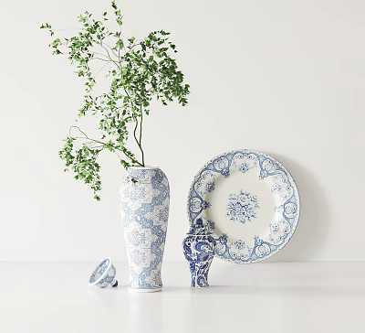 Blue And White Floral Pattern Ceramic Vase Plate Jar With Green Plant On White Tabletop 3d model