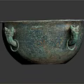 Ancient Bronze Basin With Animal Head Handles And Ornate Surface Design