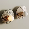 Modern Textured Wall Lamps with White Spherical Bulbs and Unique Patterned Bases 3d model