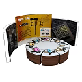 Art Installation With Curved Display Panels And Circular Wooden Table With Colorful Items