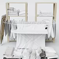 Laundry Essentials Display With Drying Rack Folded Towels And Hanging Clothes