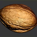 Whole Brown Walnut With Natural Textured Surface And Shiny Appearance On Dark Background