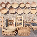 Decorative Ceramic Plates and Baskets Displayed on Shelves Against Gray Wall with Stone Floor