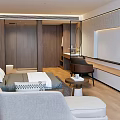Spacious Modern Hotel Room Interior With Wooden Furniture Bed Sofa And TV Console