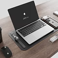 Apple MacBook Laptop Home Office Setup With Accessories On Wooden Desk