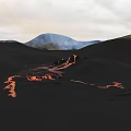 Microtopography of Volcanic Lava Flow on Black Terrain with Distant Mountains and Sky
