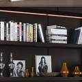 Modern Dark Wood Bookcase With Illuminated Shelves Filled With Books And Decor