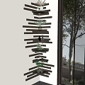 Wooden Multi Tiered Shelf Unit With Plants And Decorative Items Near Window