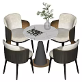 Modern Round Dining Table Set with White Chairs Dark Armrests Black Base and Green Plant