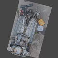 Dismantled Car Wreckage With Scattered Rusted Metal Parts On Ground