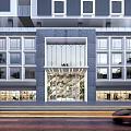 Modern High Rise Hotel Building With Glass Curtain Walls Street Vehicles And Exterior Lighting