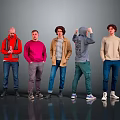 Five Men Standing Together in Casual Wear with Various Colored Tops on Gray Background