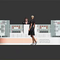 People Interacting At Modern Retail Display Shelves With Transparent Showcase And Product Arrangement