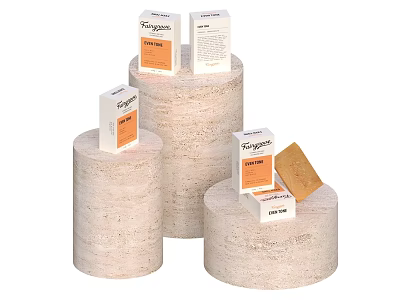 Tangle Teezer Lifestyle Products Display With Boxes And Solid Items On Beige Cylindrical Stands 3d model