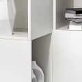 Modern White Bookcase with Geometric Compartments Holding Books Decorative Items and Lamp