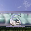 Modern Gallery Building Featuring Geometric Glass Facade Illuminated Exterior Trees And Cars Near Entrance