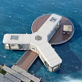 Floating Waterfront House With Circular Wooden Deck Connected To Shore And Scenic Water