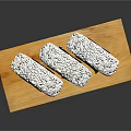 Three Sushi Rolls On Wooden Tray With Rice And Seaweed Wrap