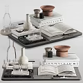 Stylish Decorative Ornament Arrangement With Stacked Books Glass Cups Vases And Bowls On Tray