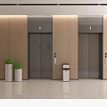Modern Elevator Lobby With Wooden Walls Elevators Green Plants In White Planters And Trash Bin