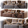 Brown Leather Two Seater Sofa With Patterned Pillows And Cozy Throws 3d model