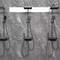 Three Modern Shower Faucets with Handheld and Top Sprays Mounted on Grey Marble Wall