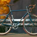 Blue Bicycle with Orange Seat Red Rims and Stylish Urban Design Features