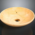 Plant Growing In Light Yellow Cracked Ceramic Pot With Drainage Hole