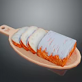 Homemade Bread on Wooden Tray Featuring Unsliced Loaf and Sliced Pieces with Orange White Coating