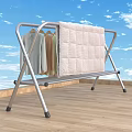 Metal Clothes Drying Rack With Hanging Bars Drying Clothes And Quilt On Balcony