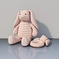 Pink Striped Stuffed Rabbit Toy With Long Ears And Small Companion On Reflective Gray Surface