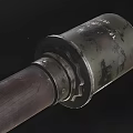 Ancient Weapon With Intricate Wooden Handle And Decorative Metal Accents