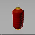Red Decorative Lantern With Yellow Top Base And Lit Candle Wick