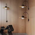 Modern Wall Lamps With Black Metal Structure And Gold Trim On Wooden Wall Surface