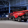Red CASE IH Combine Harvester with Large Tires Agricultural Functional Vehicle in Warehouse