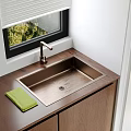 Stainless Steel Kitchen Sink With Modern Faucet And Green Cloth On Wooden Countertop By Window