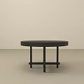Black Round Side Table With Modern Design And Crossed Legs For Living Room