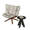 Beige Upholstered Accent Chair with Tufted Back Wooden Cross Legs and Black Round Side Table
